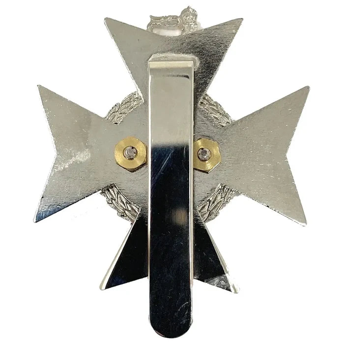Rear view of Light Dragoons Cap Badge with Kings Tudor Crown showing sliding arm attachment for secure beret fitting, made to MoD specifications. from John Bull Clothing