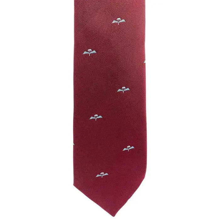Close-up of Parachute Regiment Polyester Tie featuring woven blue Para Regiment wings on maroon fabric, ideal for military uniforms. from John Bull Clothing