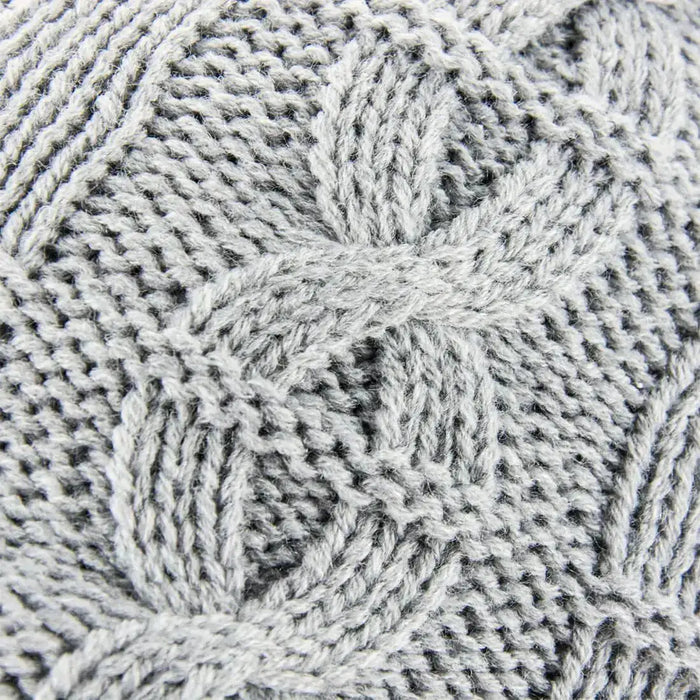 Close-up of the light gray Sealskinz Waterproof Cold Weather Cable Knit Beanie showcasing intricate cable knit detailing for a stylish and cozy look. from John Bull Clothing