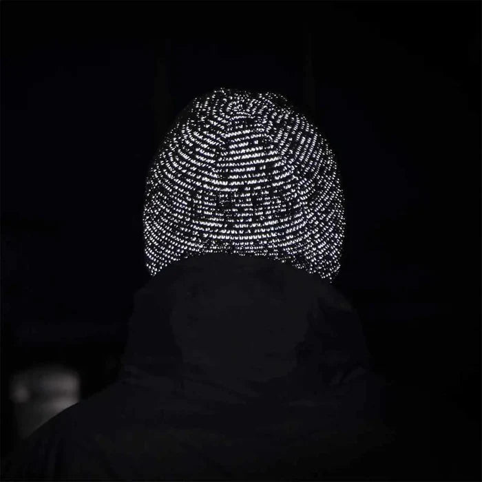 Sealskinz Waterproof Cold Weather Reflective Beanie Hat glowing in the dark due to reflective stitching. Ideal for visibility during night runs or cycling. from John Bull Clothing