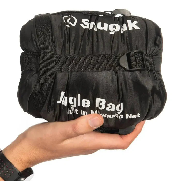 Black Snugpak Jungle Sleeping Bag with Mosquito Net compressed into a small carry size, held in hand for portability reference. from John Bull Clothing