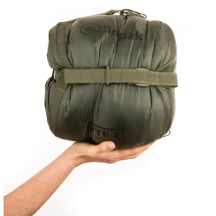 Snugpak Elite 4 Sleeping Bag Olive Green packed compactly in compression sack, showcasing lightweight portability for outdoor enthusiasts. from John Bull Clothing