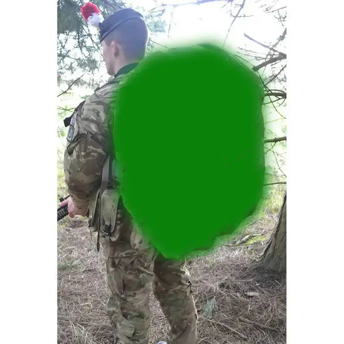 Soldier in camouflage uniform with green backpack cover in forest Olive Green from John Bull Clothing