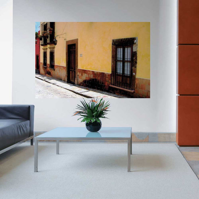 72 inch Mexican street and yellow home architecture decal installed on a wall in a living room