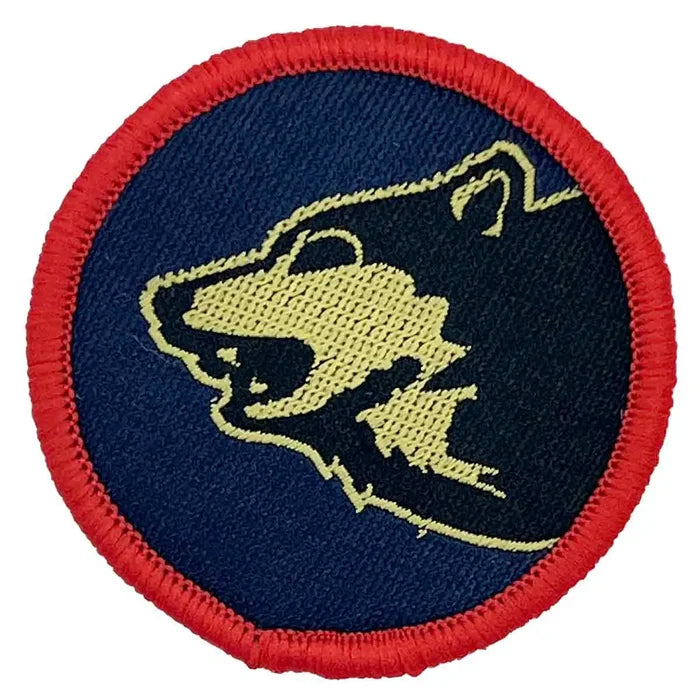 Single 104 Logistic Brigade TRF patch featuring yellow wolf head on navy background with red stitched border, ideal for iron or sew-on application. 1 Flash from  John Bull Clothing