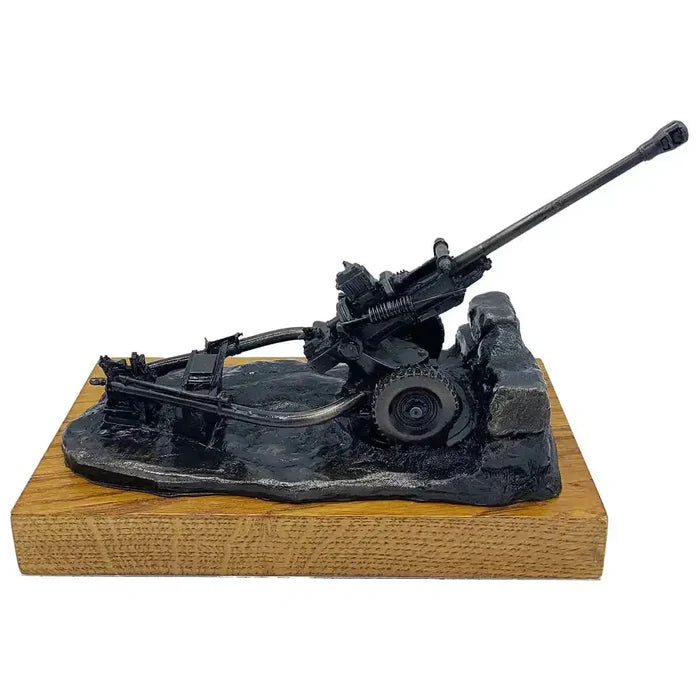 Side profile of 105mm Light Gun Bronze Resin Statue with realistic wheels and mount, perfect for collectors of military sculptures.  from  John Bull Clothing