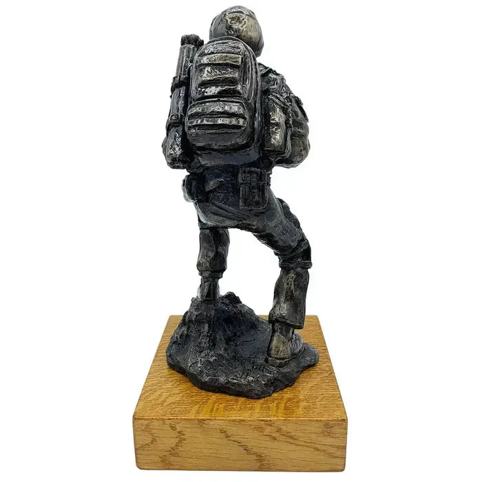 Rear view of Afghan Medic Bronze Resin Statue highlighting backpack and tactical details, perfect for military-themed sculpture collections.  from  John Bull Clothing