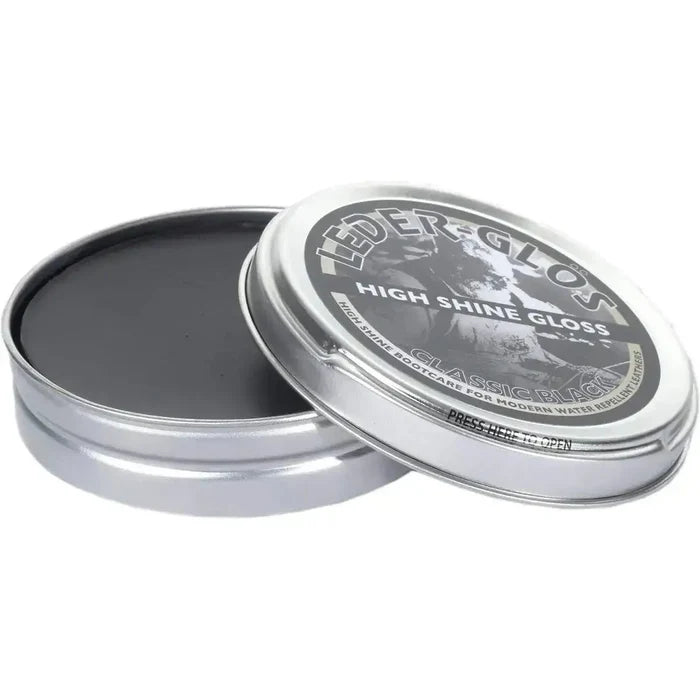 Open tin of Altberg Leder-Glos Classic Black high shine shoe polish, showing smooth black wax for polishing water repellent leather boots.  from  John Bull Clothing