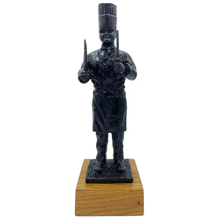 Army Chef Statue Bronze Resin | John Bull Clothing sculpture of a military chef holding utensils, mounted on a wooden base for home decor.  from  John Bull Clothing