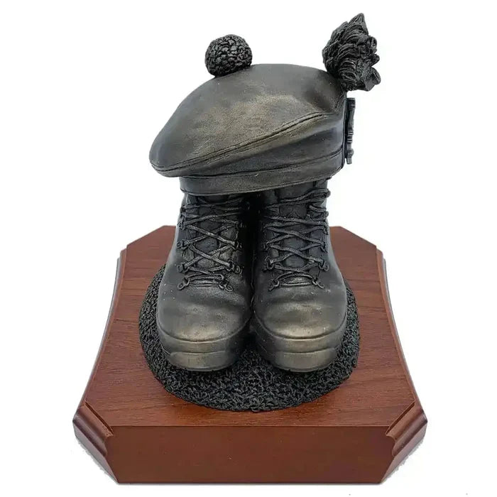 Boots and Tam O'Shanter Statue by John Bull Clothing featuring bronze resin military boots and Scottish cap on a wooden base. Ideal army tribute decor.  from  John Bull Clothing