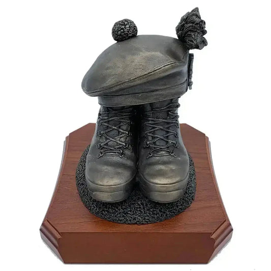 Boots and Tam O'Shanter Statue by John Bull Clothing featuring bronze resin military boots and Scottish cap on a wooden base. Ideal army tribute decor.  from  John Bull Clothing