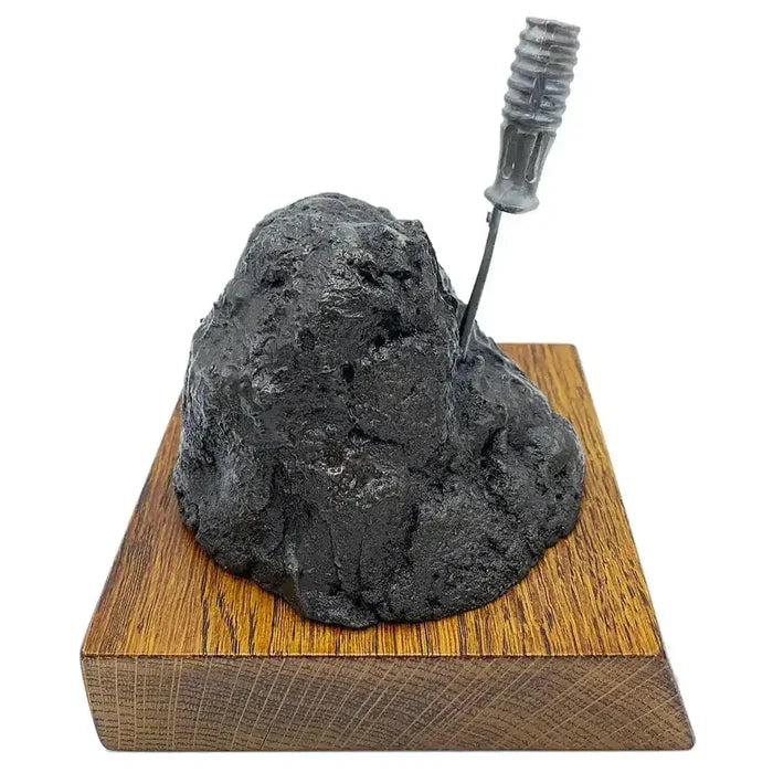 Profile view of Bronze Resin Bayonet in the Rock Presentation, ideal for military-themed decor in home and garden sculpture collections.  from  John Bull Clothing