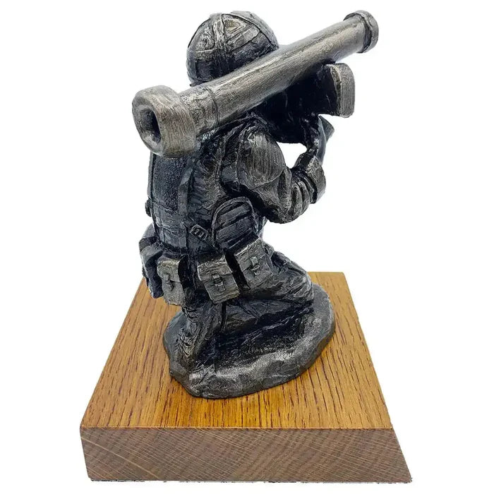 Angled back view of Bronze Resin Javelin Operator Military Statue with realistic gear and shoulder-mounted launcher, perfect for army sculpture collectors.  from  John Bull Clothing