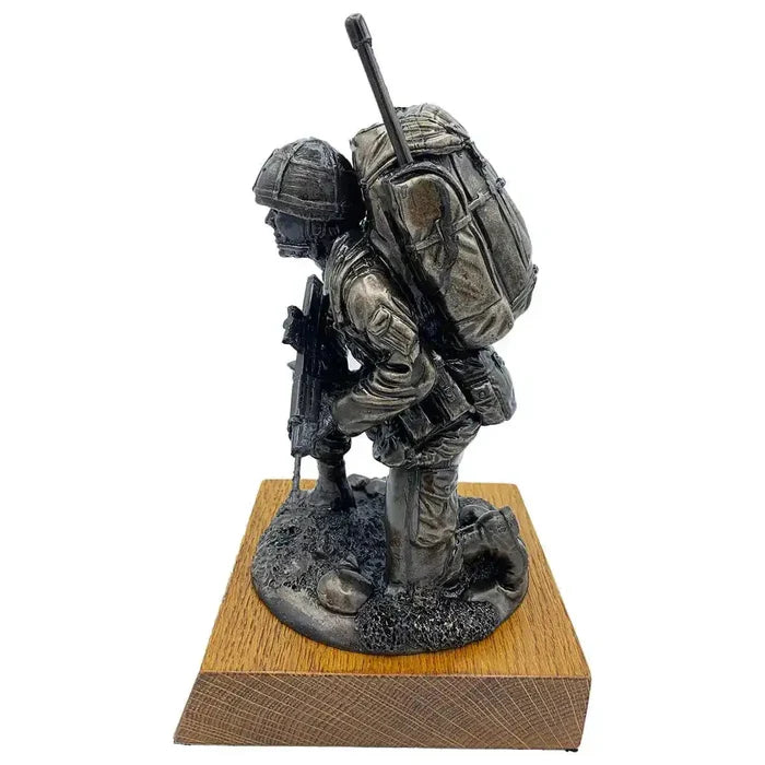 Side view of Bronze Resin Kneeling Signaller Statue with detailed bergen and SA80 rifle, mounted on solid oak wood base | John Bull Clothing  from  John Bull Clothing