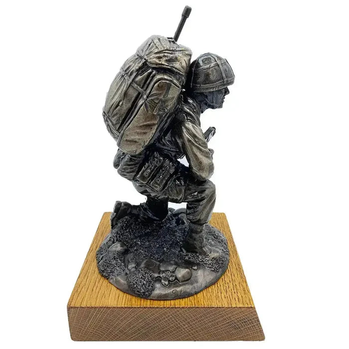 Left side angle of Bronze Resin Kneeling Signaller Statue highlighting uniform and gear details on oak base | John Bull Clothing  from  John Bull Clothing