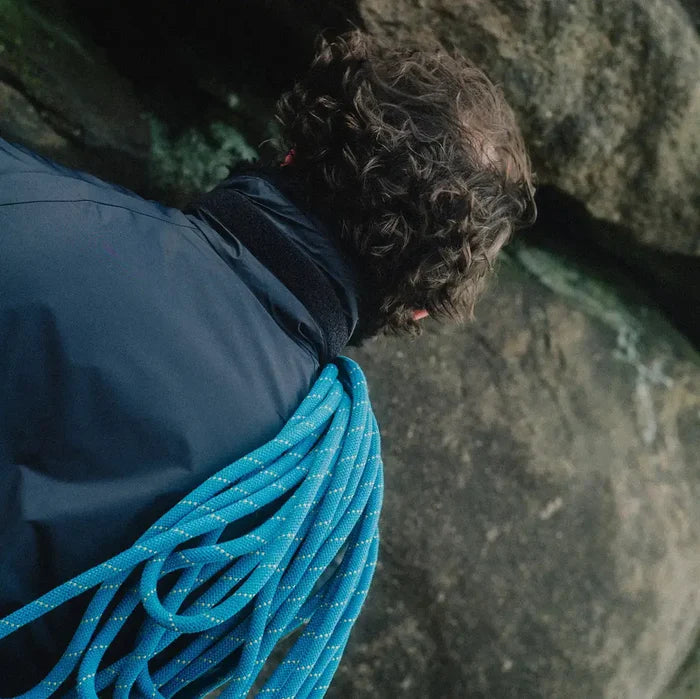 Back view of climber wearing Buffalo Mens Pertex Belay Jacket with rope over shoulder, built for cold and challenging environments.  from  John Bull Clothing