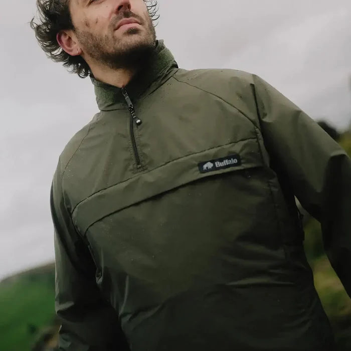 Close-up of man in olive green Buffalo Systems Special 6 Shirt by John Bull Clothing, highlighting durable Pertex fabric and chest branding.  from  John Bull Clothing