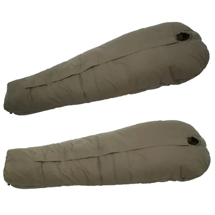 Carinthia Defence 4 Sleeping Bag Olive Green, displayed in two different angles, highlighting its compact and insulated design for outdoor use.  from  John Bull Clothing