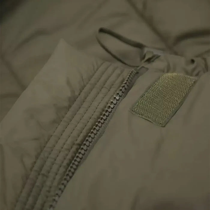 Close-up of the Carinthia Defence 4 Sleeping Bag Olive Green zipper system with reinforced stitching for durability and secure closure.  from  John Bull Clothing