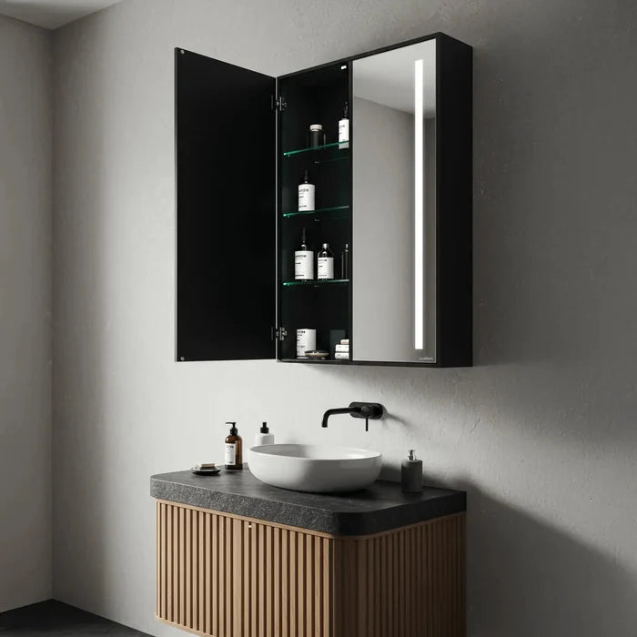 Matte black double door bathroom mirror cabinet with LED strip light and open glass shelves with toiletries - Glazonoid