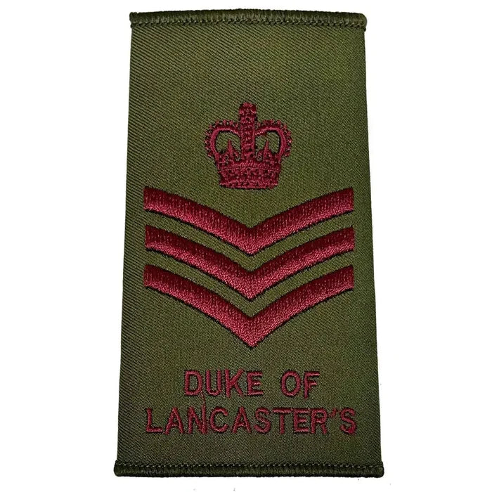 Duke of Lancasters Olive Green Rank Slide with crown and three chevrons in maroon, military uniform insignia from John Bulls. Staff Sergeant from  John Bull Clothing