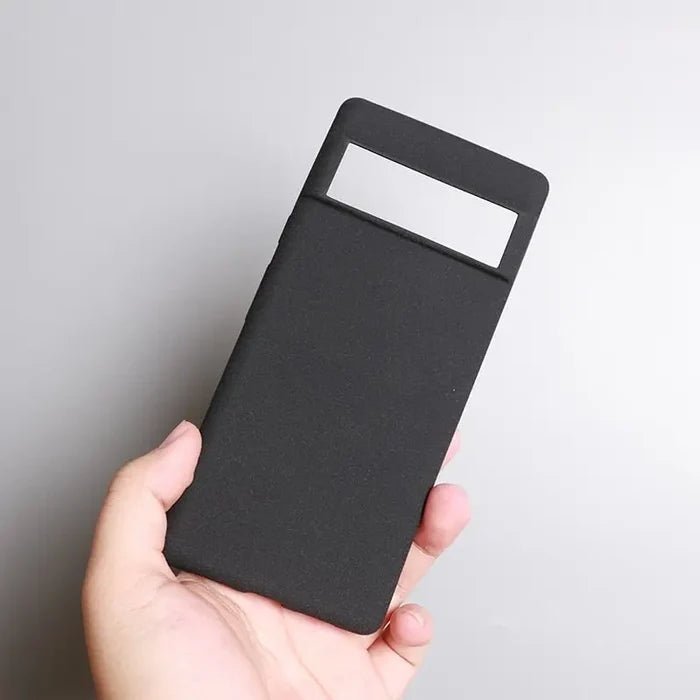 a hand holding a black card case