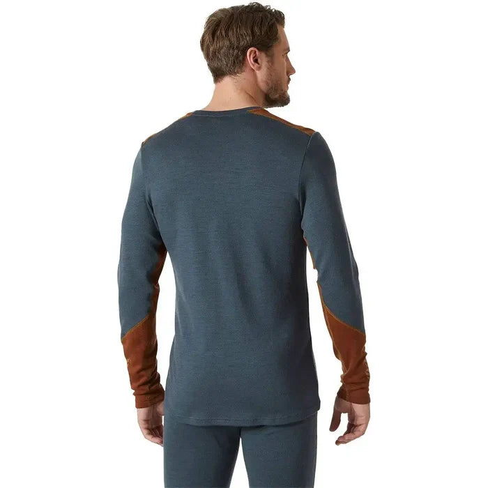 Back view of model wearing Helly Hansen Lifa Merino Midweight Crew Base Layer in dark teal, displaying ergonomic fit and durable fabric construction.  from  John Bull Clothing