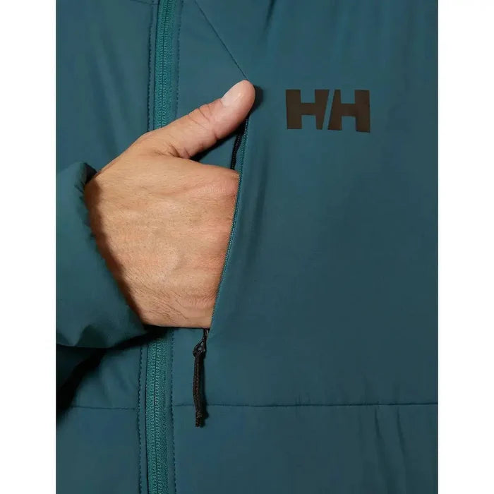 Zippered chest pocket of the Helly Hansen Odin Stretch Hood Insulator 2.0 Jacket, providing secure storage with a sleek design and HH logo branding.  from  John Bull Clothing