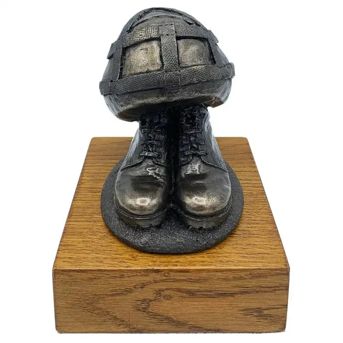Helmet & Boots Statue Bronze Resin | John Bull Clothing military tribute sculpture on wooden base, ideal for home or garden decor.  from  John Bull Clothing