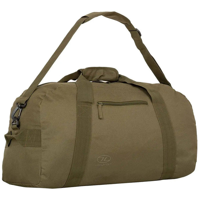 Highlander Cargo 65 Litre Carry Bag in olive with an adjustable shoulder strap, reinforced handles, and a spacious main compartment. Ideal for carrying heavy loads.  from  John Bull Clothing
