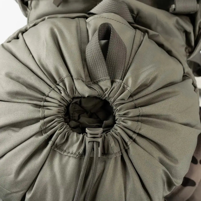 Close-up of drawstring closure on olive Highlander Forces Elite 33 Litre Rucksack, highlighting secure and expandable top-loading design.  from  John Bull Clothing