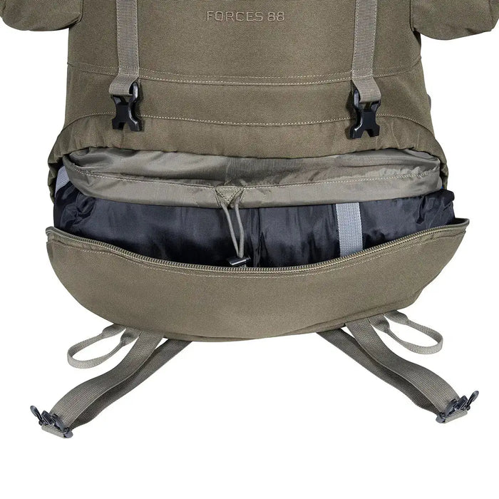 Bottom compartment of Highlander Forces Elite 88L Pack unzipped, showing internal storage space for sleeping bags or bulky items.  from  John Bull Clothing