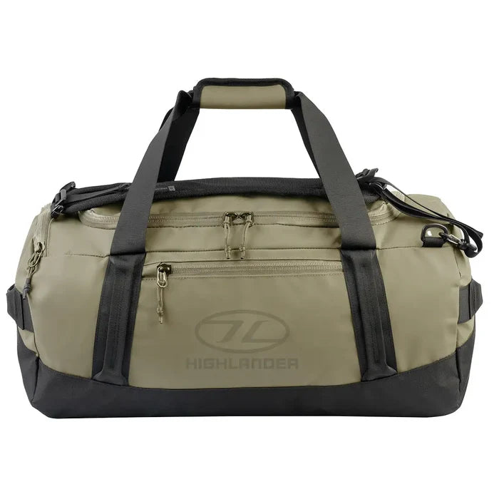 Highlander Hauler Duffel Bag in green with black accents, featuring durable 600D PVC material and multiple compartments for versatile storage. 45 litre from  John Bull Clothing