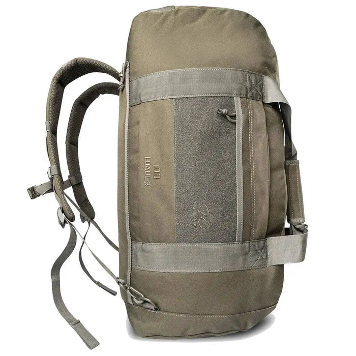 Highlander Loader 100L Holdall Bag Gen2 in olive green, shown in a vertical position with backpack straps for versatile carrying options.  from  John Bull Clothing