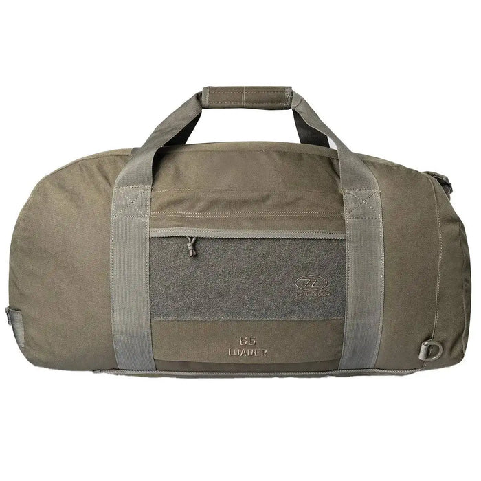Highlander Loader 65L Holdall Bag Gen2 in olive green with durable polyester fabric, reinforced handles, and a front zip pocket for secure storage. Ranger Green from  John Bull Clothing