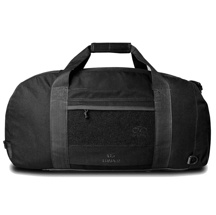 Highlander Loader 65L Holdall Bag Gen2 in black with a rugged design, front zip pocket, and reinforced handles for secure and durable transport. Black from  John Bull Clothing