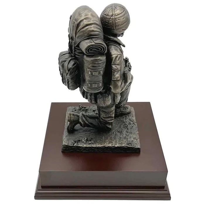 Side view of Kneeling Combat Figure with Beret statue showing soldier's backpack and kneeling pose, a tribute piece for army enthusiasts.  from  John Bull Clothing