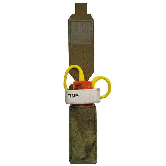 Open Luminae Multicam TQ Pouch MTP displaying a tourniquet and medical shears inside. Designed for quick access in emergency situations.  from  John Bull Clothing