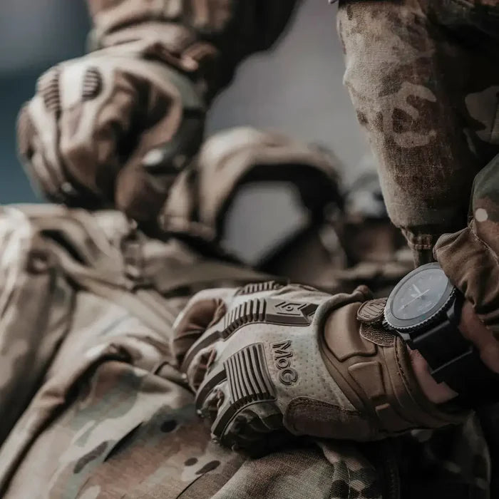 Close-up of MoG Target High Abrasion Ergoshield Gloves in Multicam during field operation, emphasizing rugged design and protective features for professionals.  from  John Bull Clothing