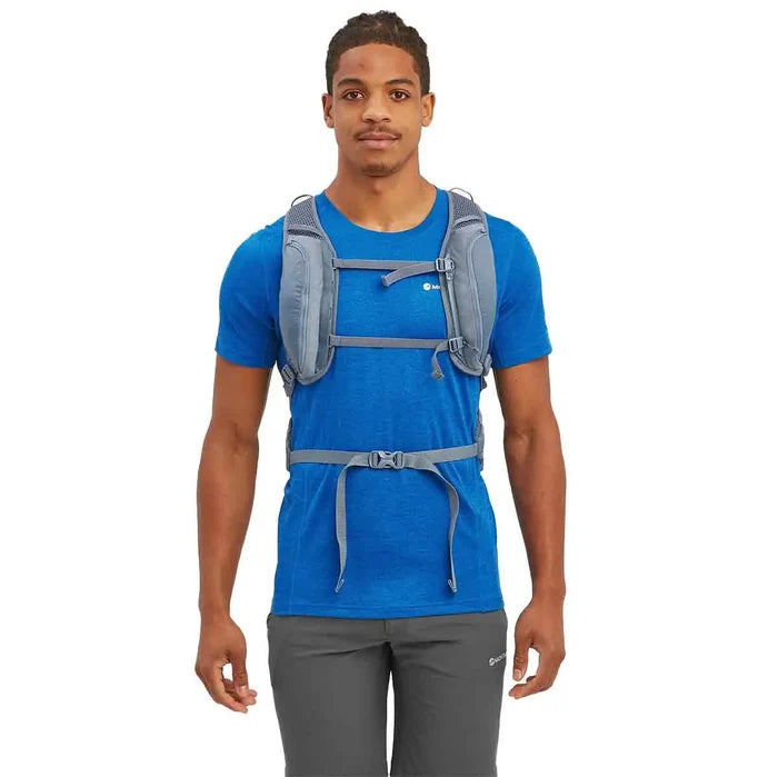 Front view of a man wearing the Montane Trailblazer 18L Backpack, showing adjustable chest straps for a secure fit.  from  John Bull Clothing