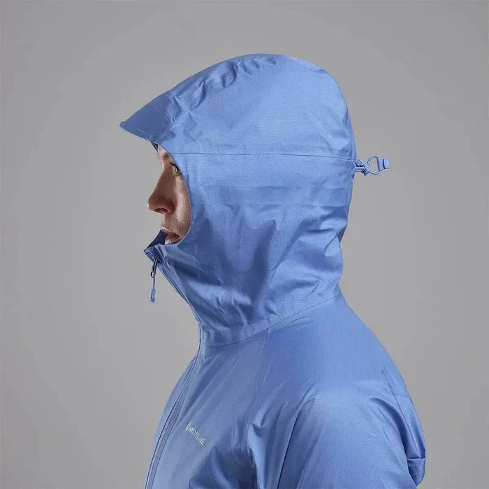 Side profile of Montane Women's Cetus Lite Waterproof Jacket in light blue, showing the adjustable hood and high collar for extra protection.  from  John Bull Clothing