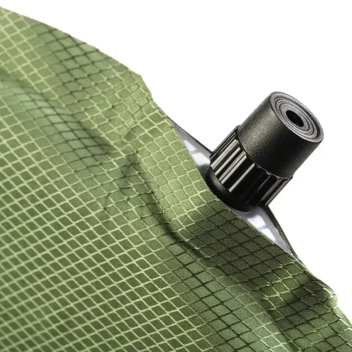 Self inflating sleeping pad with green diamond pattern fabric and black valve  from  John Bull Clothing