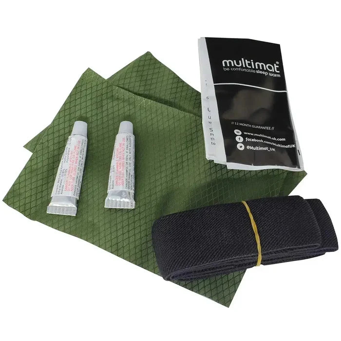Camping sleeping pad with repair kit, straps, and instruction manual in green and black  from  John Bull Clothing
