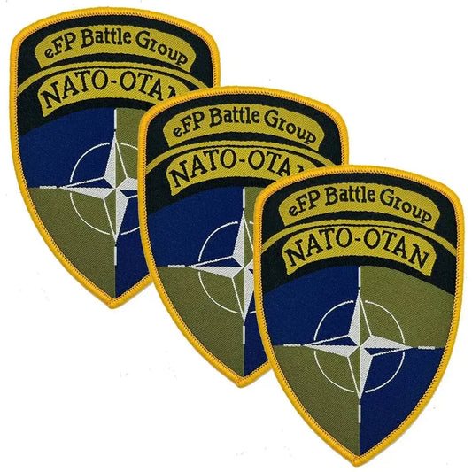 Set of three Nato eFP Battle Group Iron On TRF Flash patches with embroidered NATO-OTAN emblem and yellow border, ideal for military uniforms. 3 Pack from  John Bull Clothing