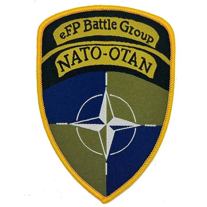 Single Nato eFP Battle Group Iron On TRF Flash patch with embroidered NATO-OTAN emblem, durable fabric, and yellow border for military uniforms. Single Flash from  John Bull Clothing