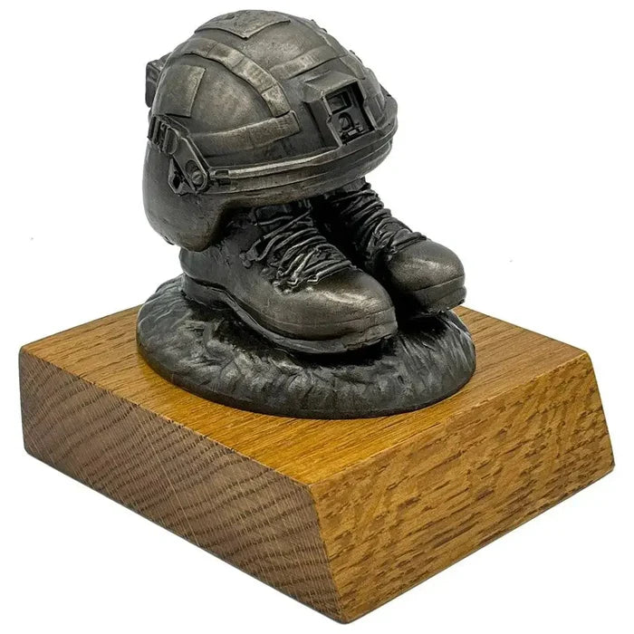 Helmet and Boots Statue Bronze Resin | John Bull Clothing sculpture featuring British Army ballistic helmet and AKU-style boots on wood base.  from  John Bull Clothing
