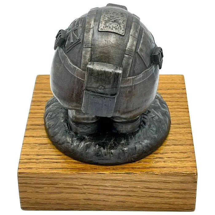 Rear view of Helmet and Boots Statue Bronze Resin with helmet strap and texture details, mounted on a polished wooden base for display.  from  John Bull Clothing