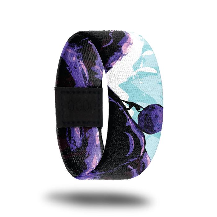 Outside Design of No Days Off: blue and white sketched sky background with black and purple mountains, in the center of the image there is the shadow of a man pushing a boulder up the mountain