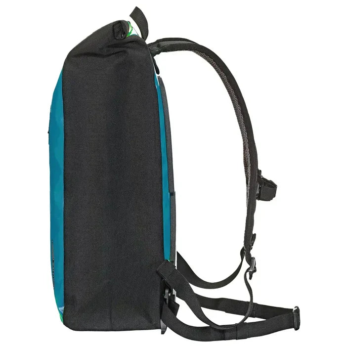 Side profile of Ortlieb Velocity 23L Dry Backpack in teal, highlighting its slim, structured silhouette and durable black side panels.  from  John Bull Clothing