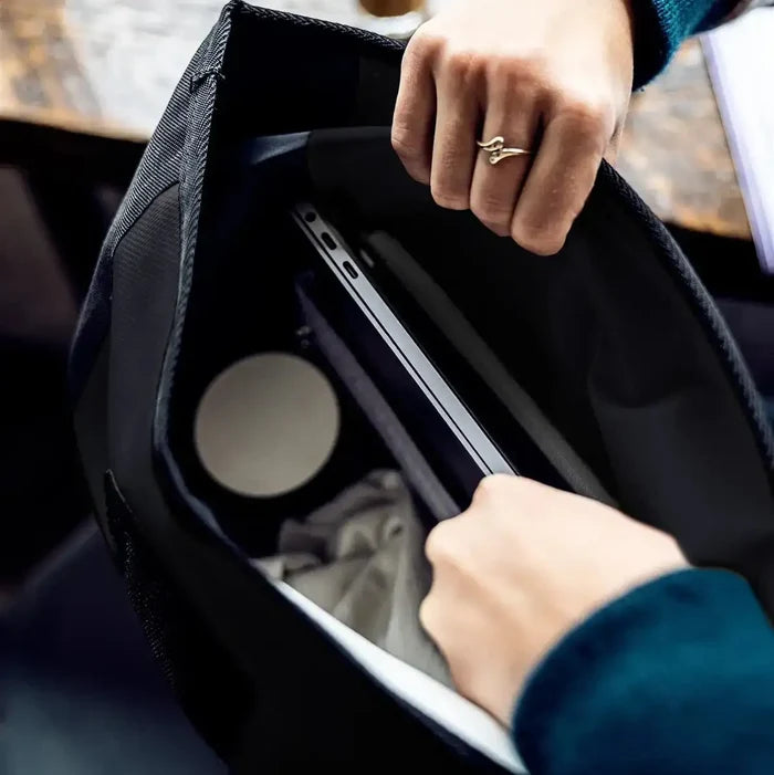 Close-up of Ortlieb Velocity 23L Dry Backpack in use, displaying laptop and daily essentials inside the waterproof main compartment.  from  John Bull Clothing
